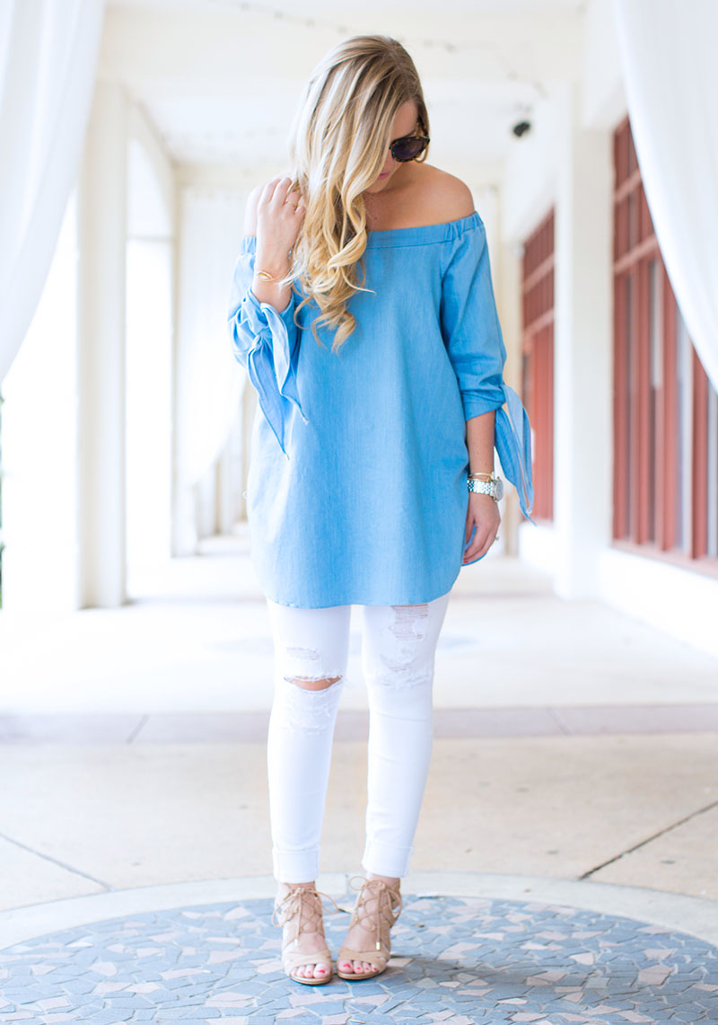 light blue off-the-shoulder tie sleeve top and white denim